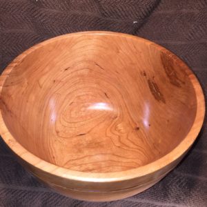 I love the grain that cherry has. For this particular piece of wood, it had started to break down, which is where the dark coloration comes from on the end-grain part of the bowl.