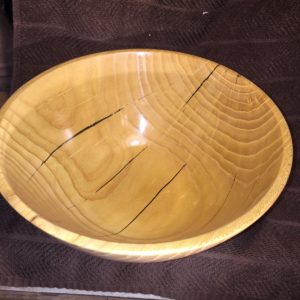 In the April, 2016, blog, I talked about a bowl that I had started out of Mulberry and talked about how bad it cracked while it was drying. This is what the final project turned out to be. I filled all of the cracks with black CA glue, which not only keeps the bowl from continued cracking, but also looks pretty good. The white lines are from where the wood had cracked, but not deep enough to where the black CA glue could get into the crack. These are sealed with regular, clear, CA glue.